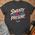 Dark gray t-shirt with "Sweaty But Present" text and a retro design.