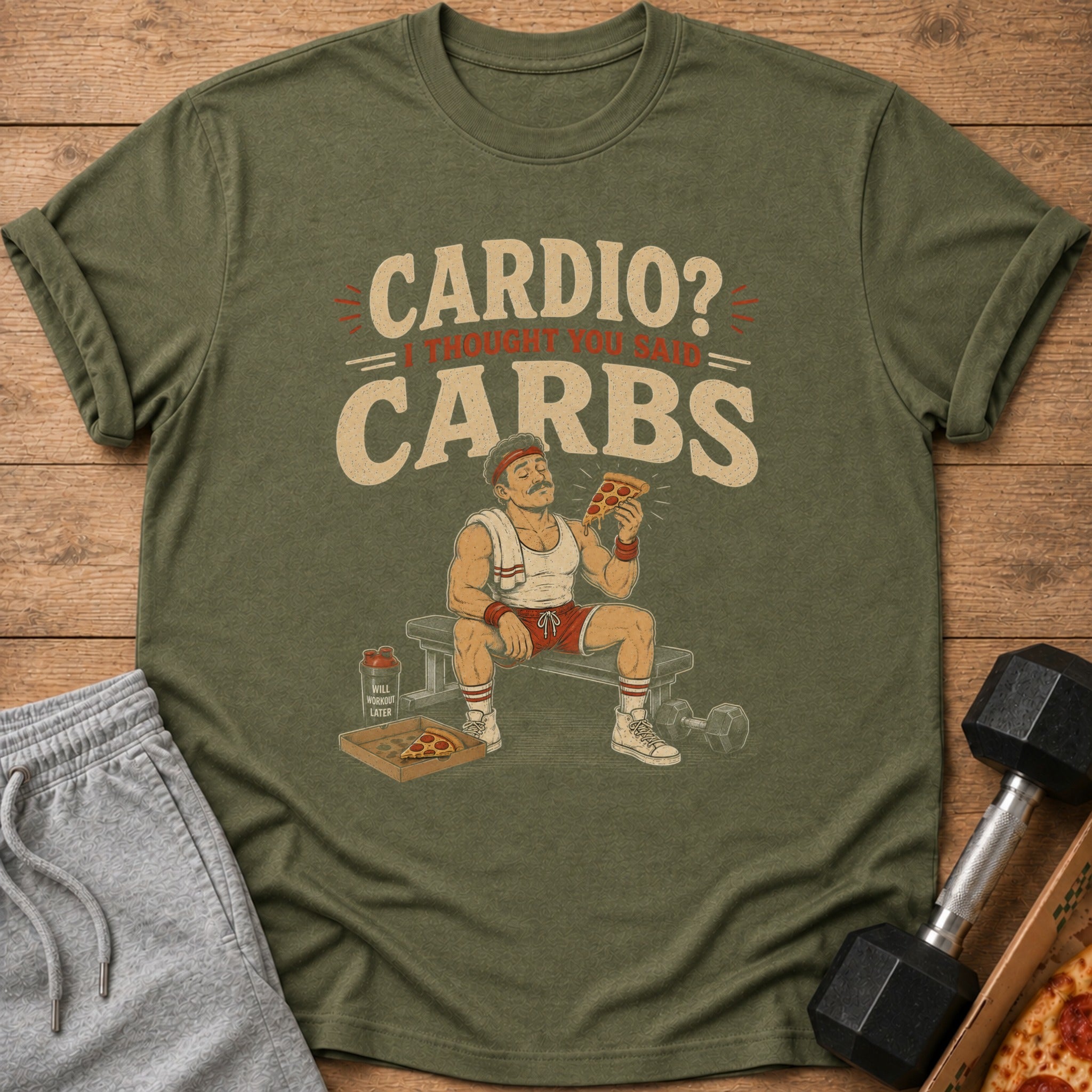 Olive t-shirt with graphic reading "Cardio? I thought you said Carbs" and cartoon man eating pizza.