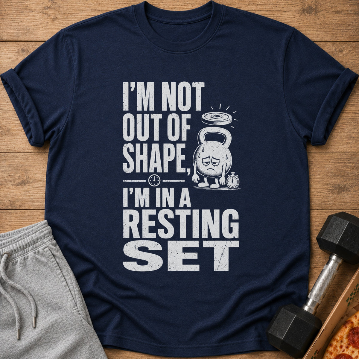 Dark blue t-shirt with distressed white text reading "I'M NOT OUT OF SHAPE, I'M IN A RESTING SET".