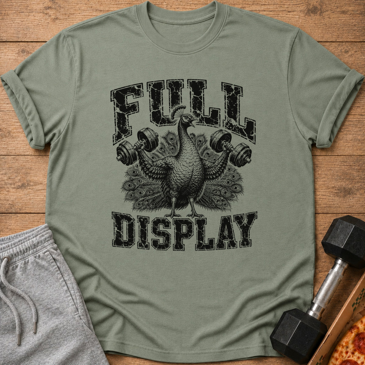 T-shirt with a peacock lifting dumbbells and text "FULL DISPLAY".