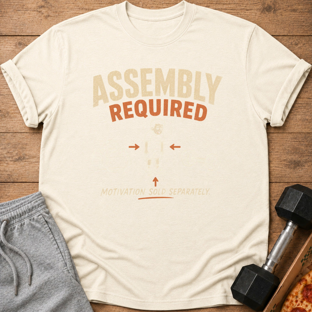Cream t-shirt with "ASSEMBLY REQUIRED MOTIVATION SOLD SEPARATELY" text.