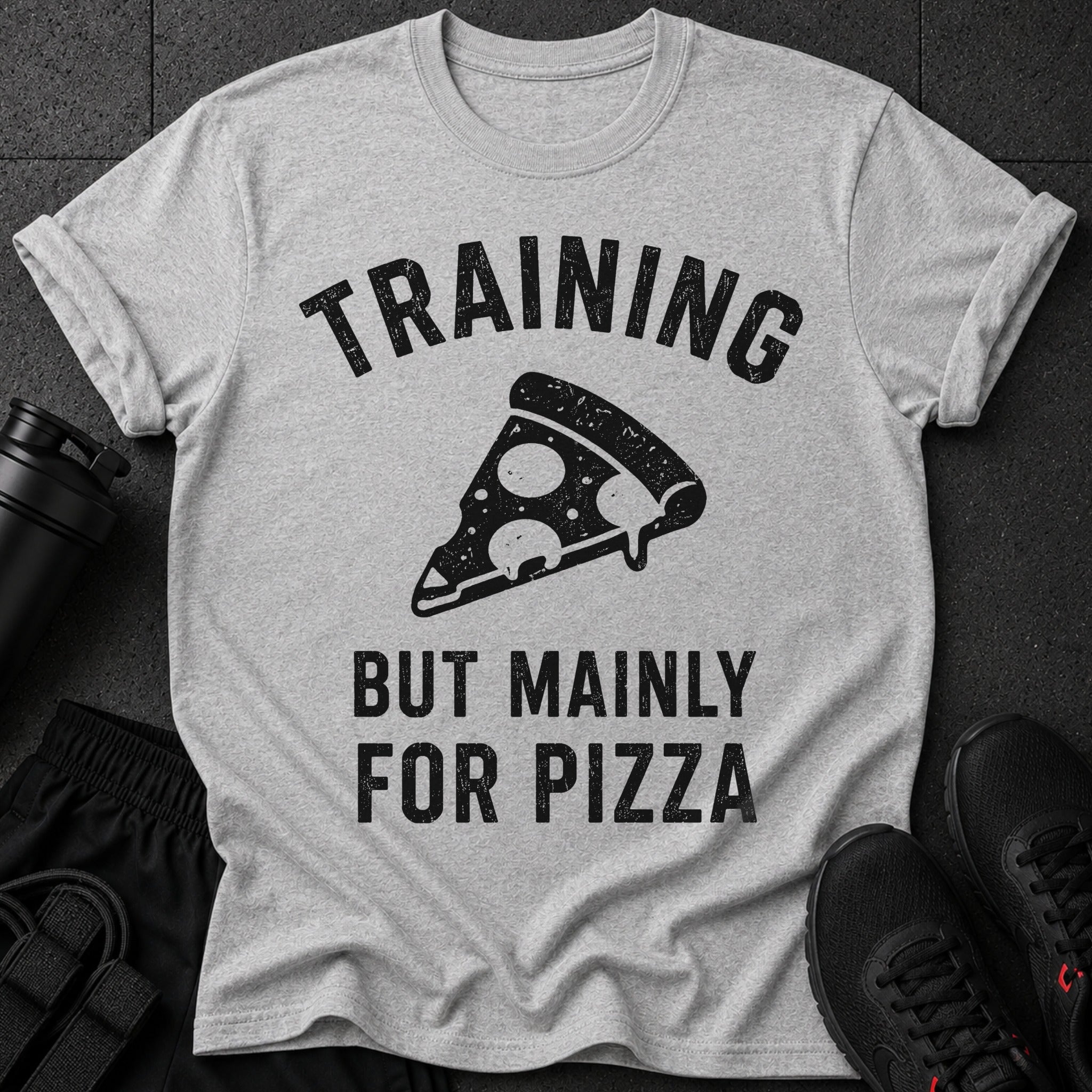 Grey t-shirt with "TRAINING BUT MAINLY FOR PIZZA" text and pizza graphic.