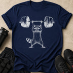 Raccoon lifting a barbell on a navy t-shirt with workout gear.