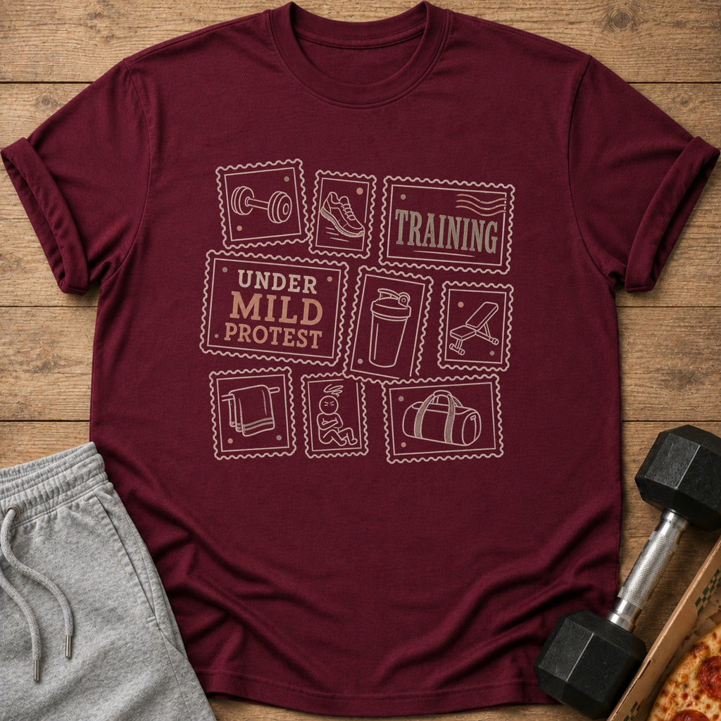 Maroon t-shirt with stamp-like graphics of gym equipment and "UNDER MILD PROTEST TRAINING."