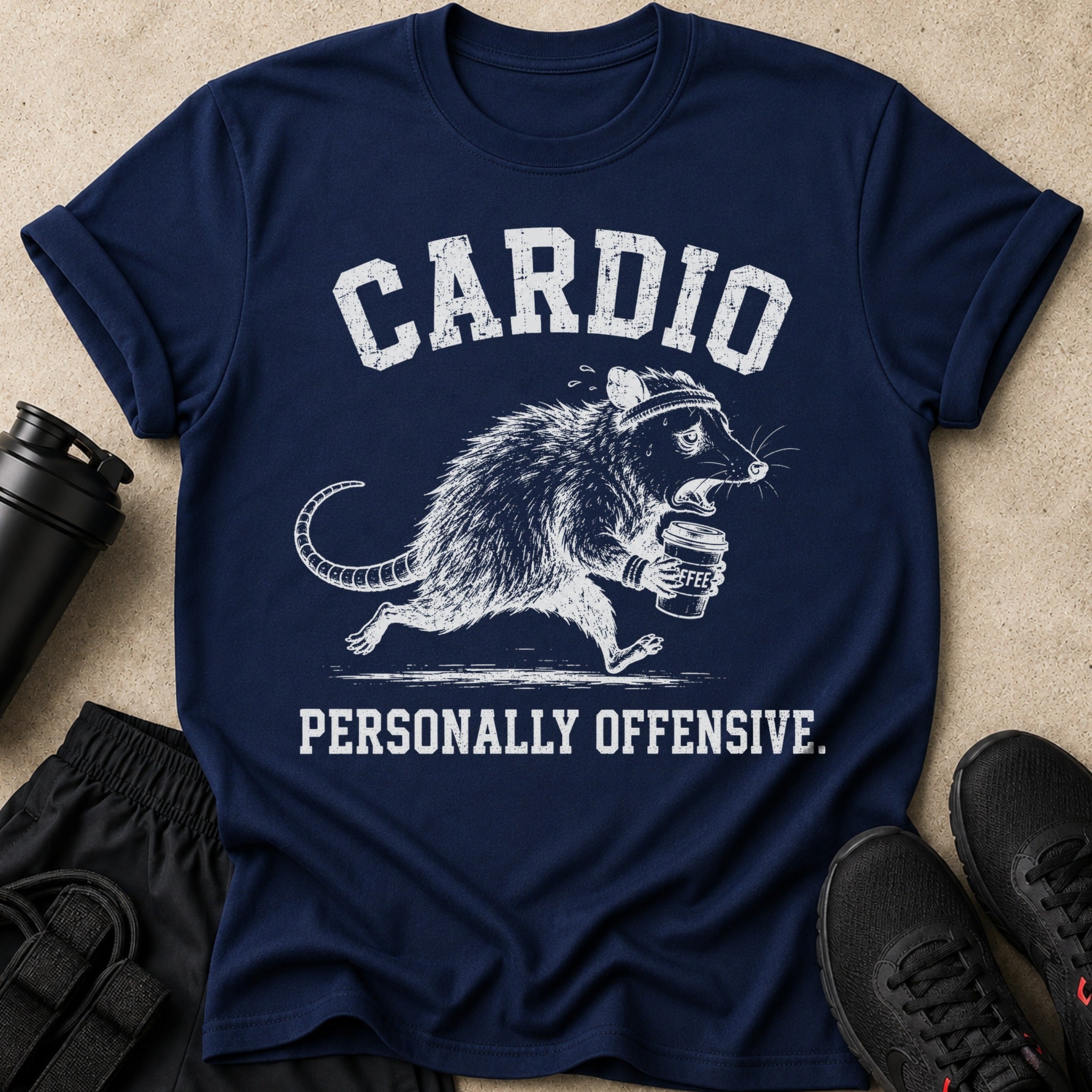 Navy t-shirt with distressed graphic of a rat running with coffee, text says "CARDIO PERSONALLY OFFENSIVE."