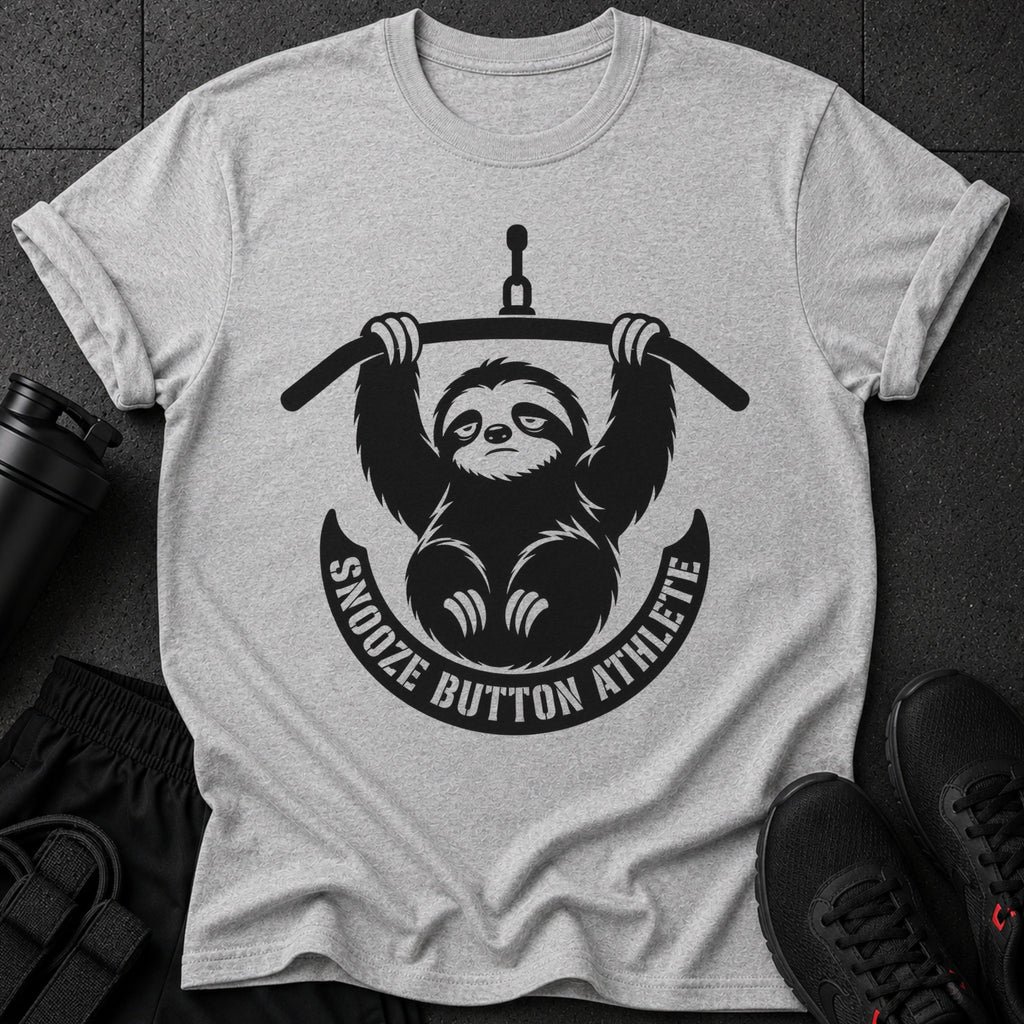 Grey t-shirt with a black graphic of a sloth holding a weight bar and text "Snooze Button Athlete."