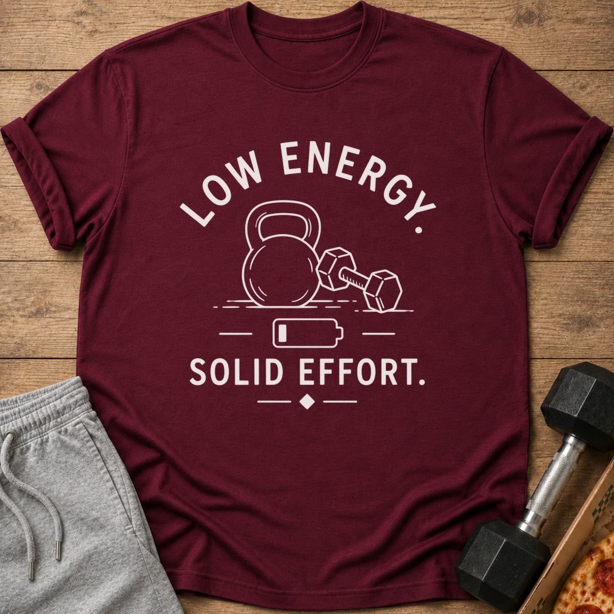 Maroon t-shirt with "LOW ENERGY. SOLID EFFORT." text and gym graphics.