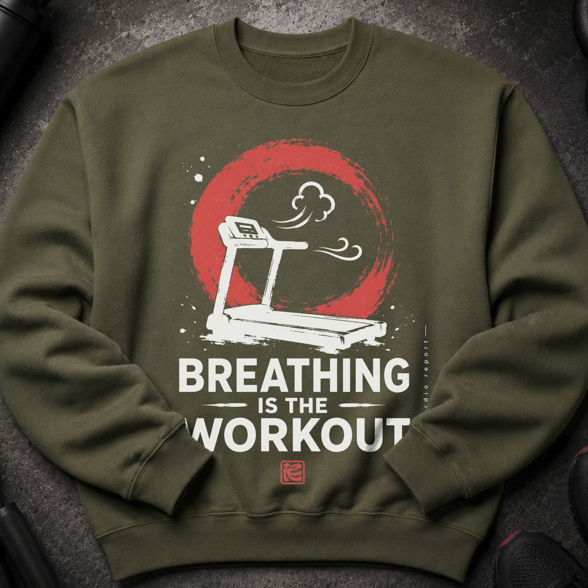 Green sweatshirt with treadmill graphic and text "BREATHING IS THE WORKOUT".
