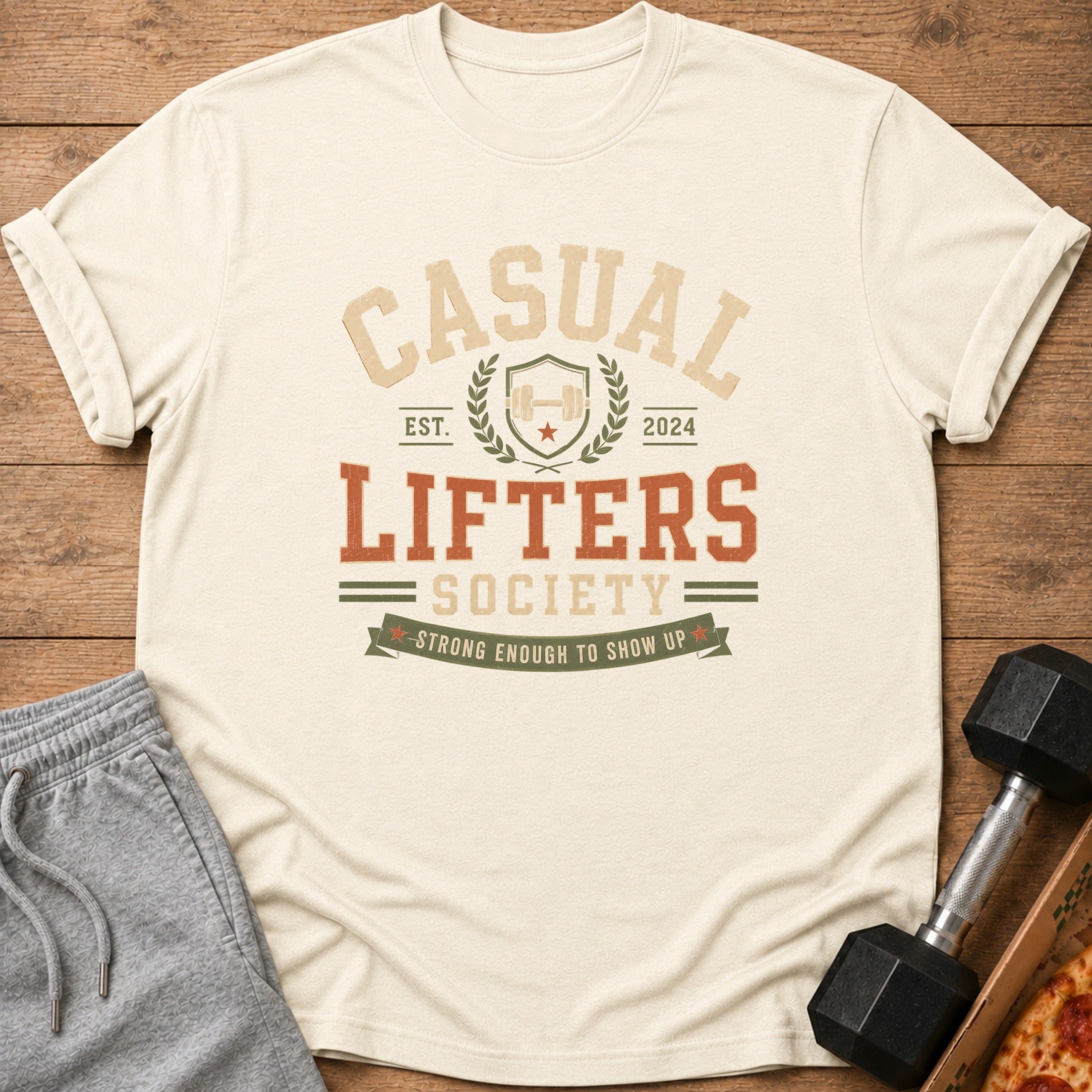 Casual Lifters Society Est. 2024 t-shirt with dumbbell and pizza.