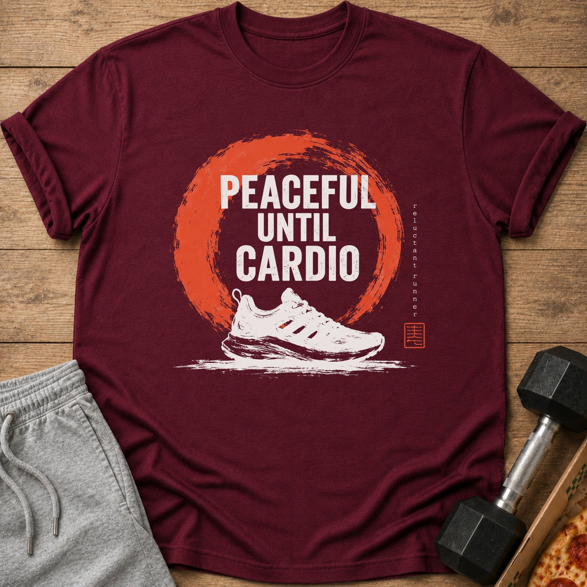 Maroon t-shirt with "Peaceful Until Cardio" text and running shoe graphic.