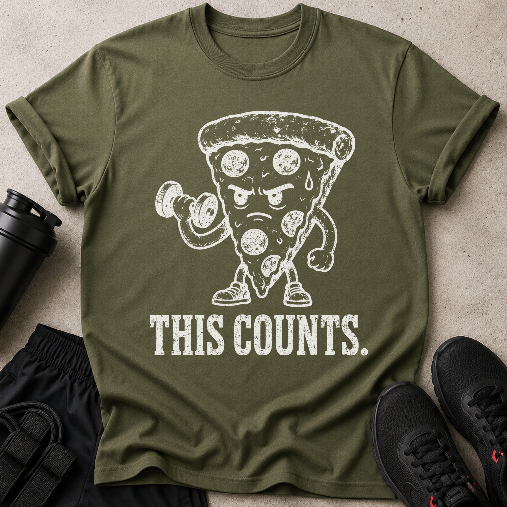 Green t-shirt with distressed white graphic of a pizza lifting weights and text that reads "THIS COUNTS."