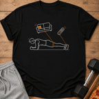 Line art t-shirt shows person planking with remote and couch overhead.