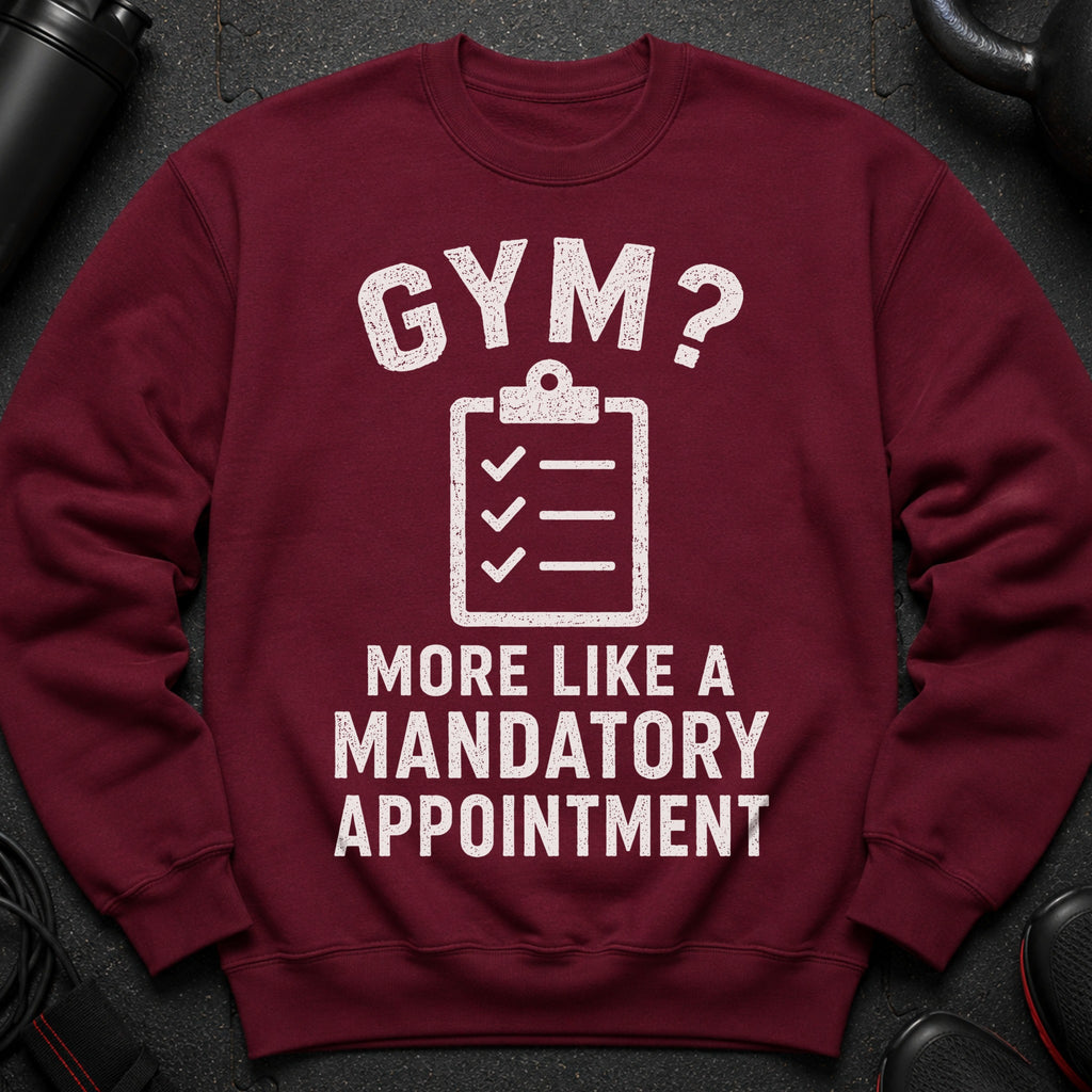 Maroon sweatshirt with white text "GYM? MORE LIKE A MANDATORY APPOINTMENT".