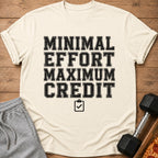 Cream t-shirt with black text "MINIMAL EFFORT MAXIMUM CREDIT" and a checklist icon.