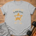 Gray t-shirt with cartoon star graphic and text "KIND OF A BIG DEAL."