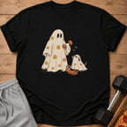 Black t-shirt with ghosts, dog, and weights illustration.