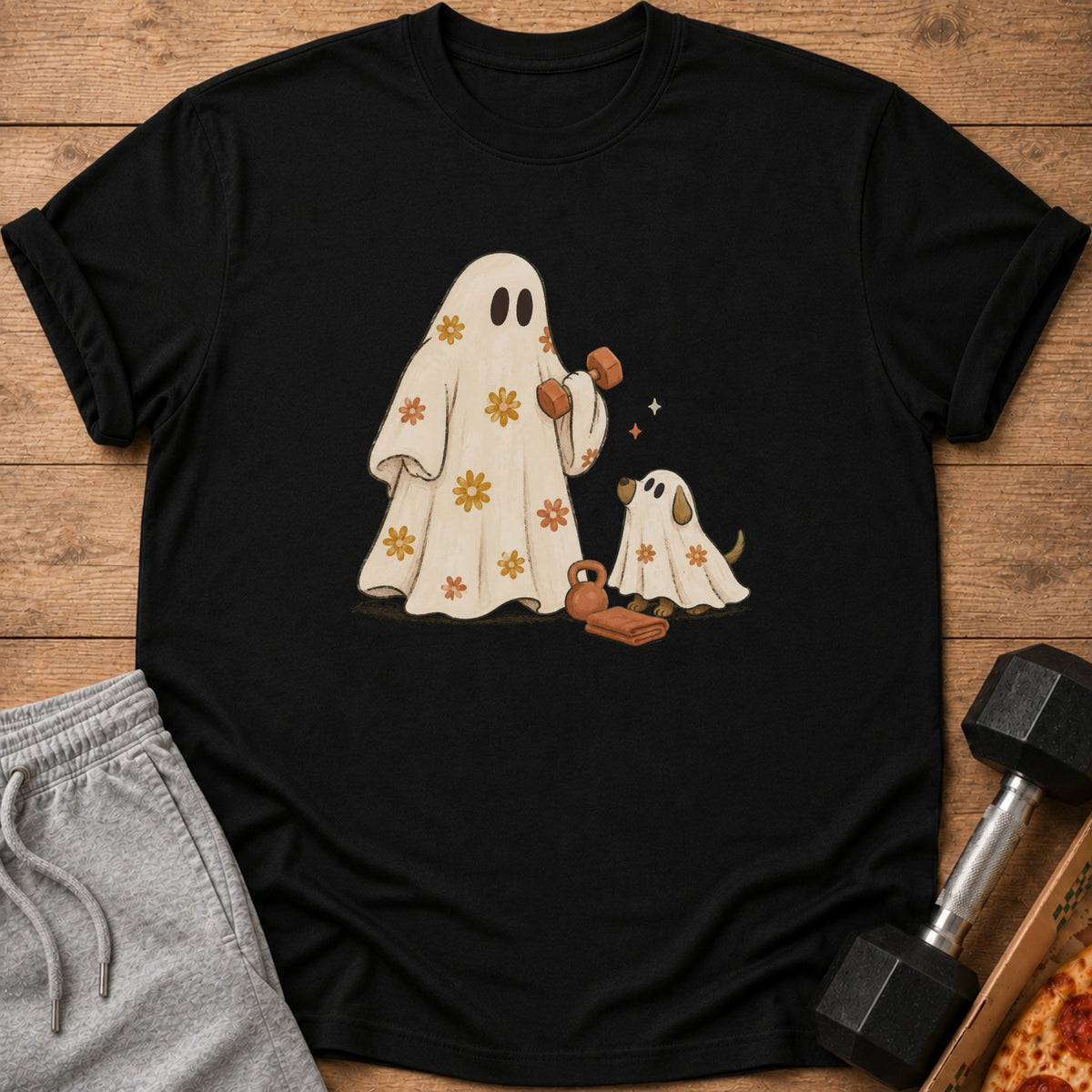 Black t-shirt with ghosts, dog, and weights illustration.