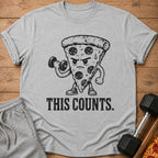 Grey t-shirt with a cartoon slice of pepperoni pizza lifting a dumbbell.