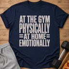 Navy t-shirt with text "AT THE GYM PHYSICALLY =AT HOME= EMOTIONALLY".