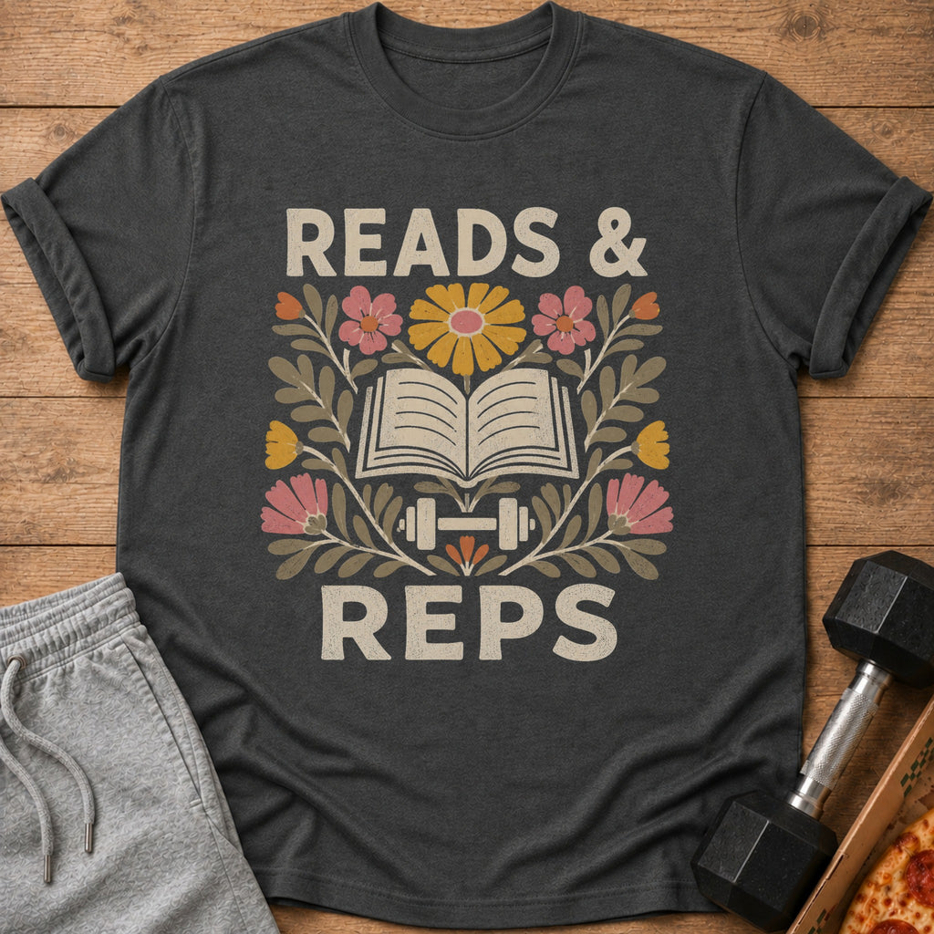 Dark gray t-shirt featuring a retro graphic with an open book, dumbbells, flowers, and the text READS & REPS.