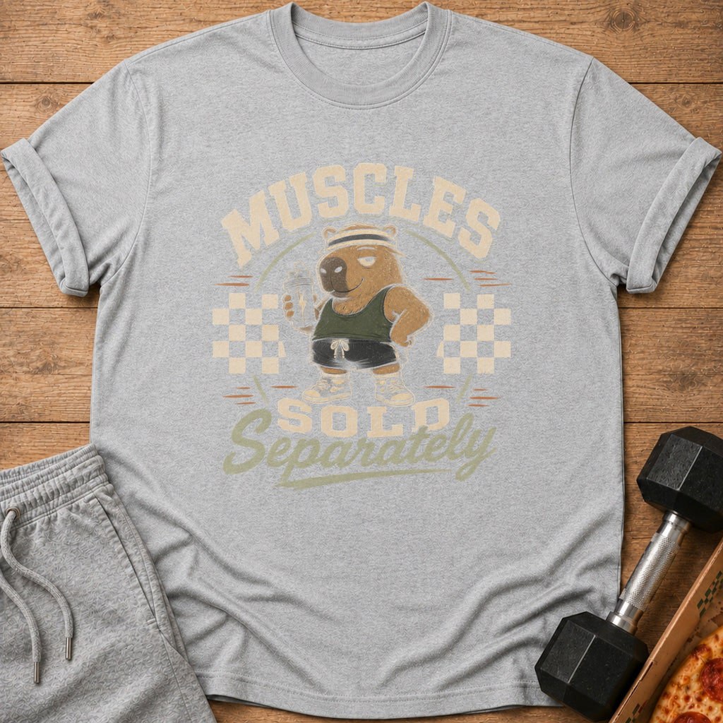 Gray t-shirt with a cartoon capybara lifting weights and the text "Muscles Sold Separately".