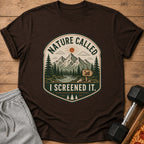 Brown t-shirt with "Nature Called I Screened It" mountain landscape graphic.