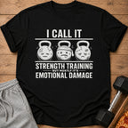 Black t-shirt with kettlebells and the text "I call it strength training but mostly it's emotional damage".