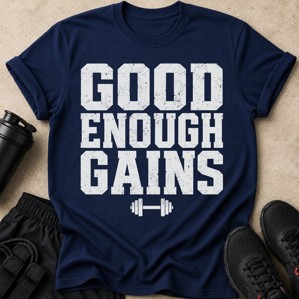 Navy t-shirt with distressed white text "GOOD ENOUGH GAINS" and a dumbbell graphic.