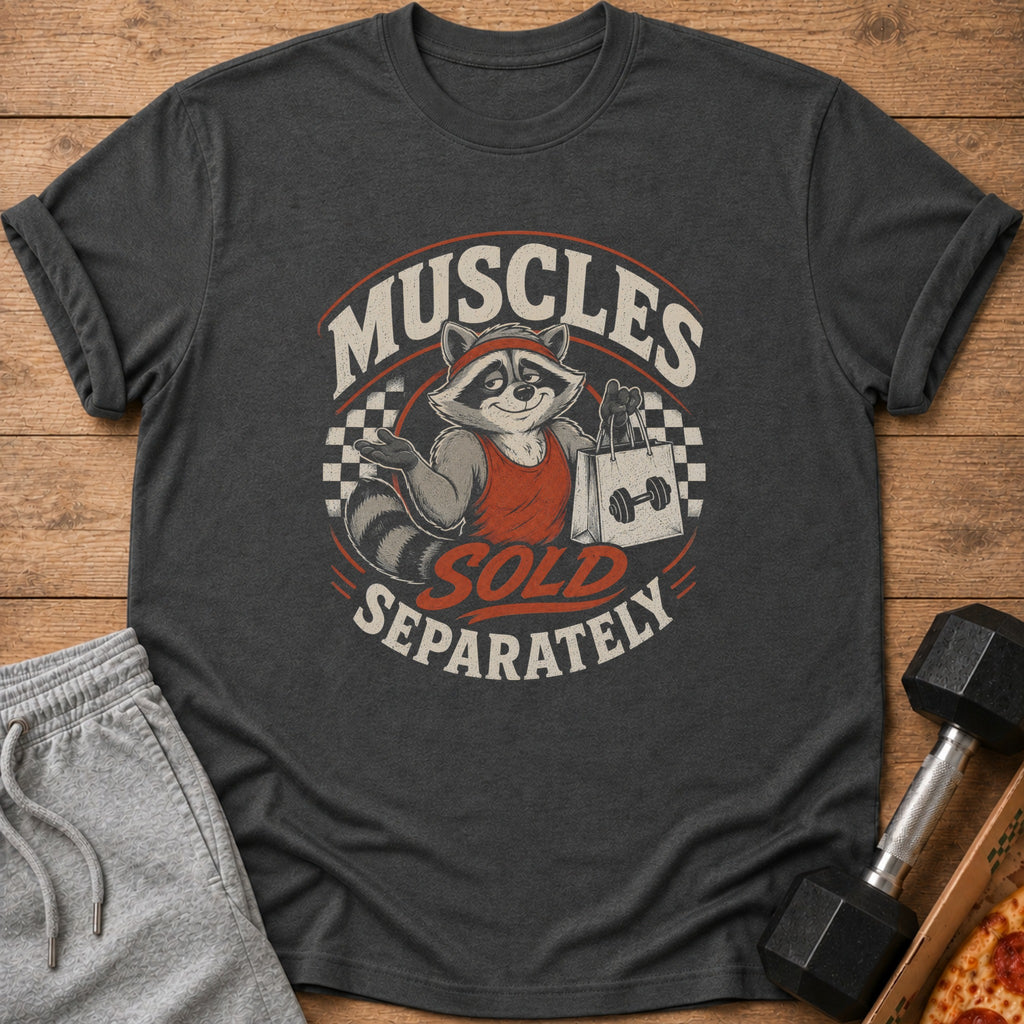 T-shirt graphic of a raccoon wearing a red headband and tank top holding a shopping bag with "Muscles Sold Separately" text.