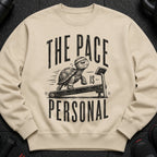 Crewneck sweatshirt with distressed graphic of a turtle on a treadmill and text "THE PACE IS PERSONAL".