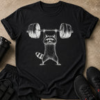 Black t-shirt with a white illustration of a raccoon lifting a barbell.