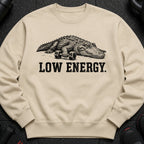 Crewneck sweatshirt with alligator and "LOW ENERGY" text graphic.