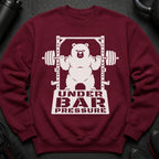 Maroon sweatshirt with white graphic of a bear lifting a barbell. Text reads "UNDER BAR PRESSURE".