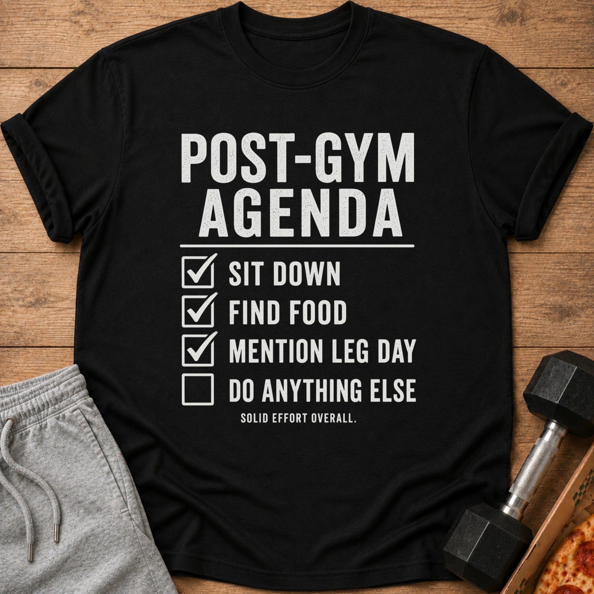 Black t-shirt with "Post-Gym Agenda" text and a checklist of gym-related activities.