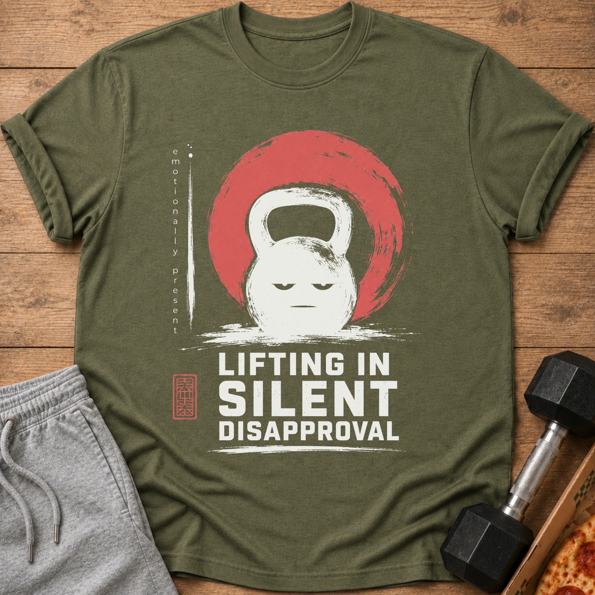 Green t-shirt with kettlebell graphic and text: Lifting in Silent Disapproval.