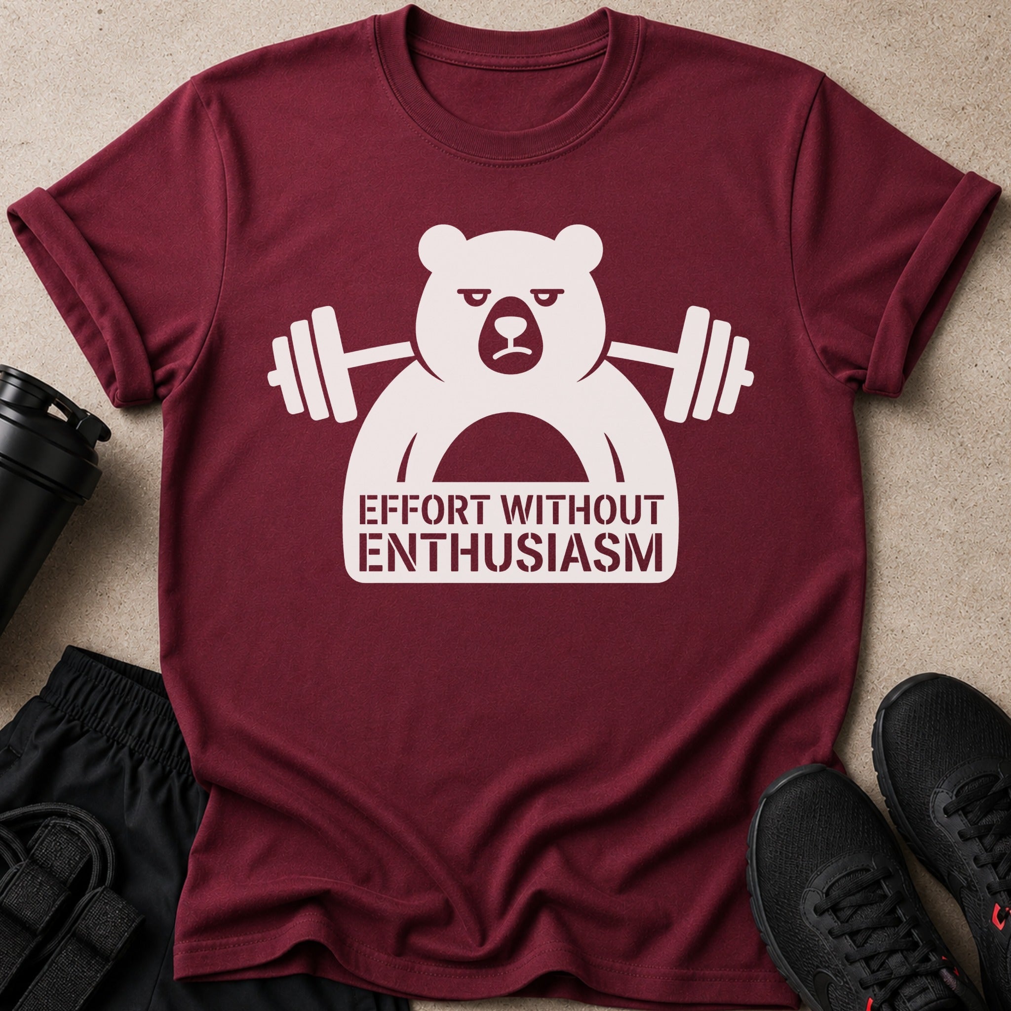 Maroon t-shirt with a white graphic of a bear barbell lifting and text "EFFORT WITHOUT ENTHUSIASM".
