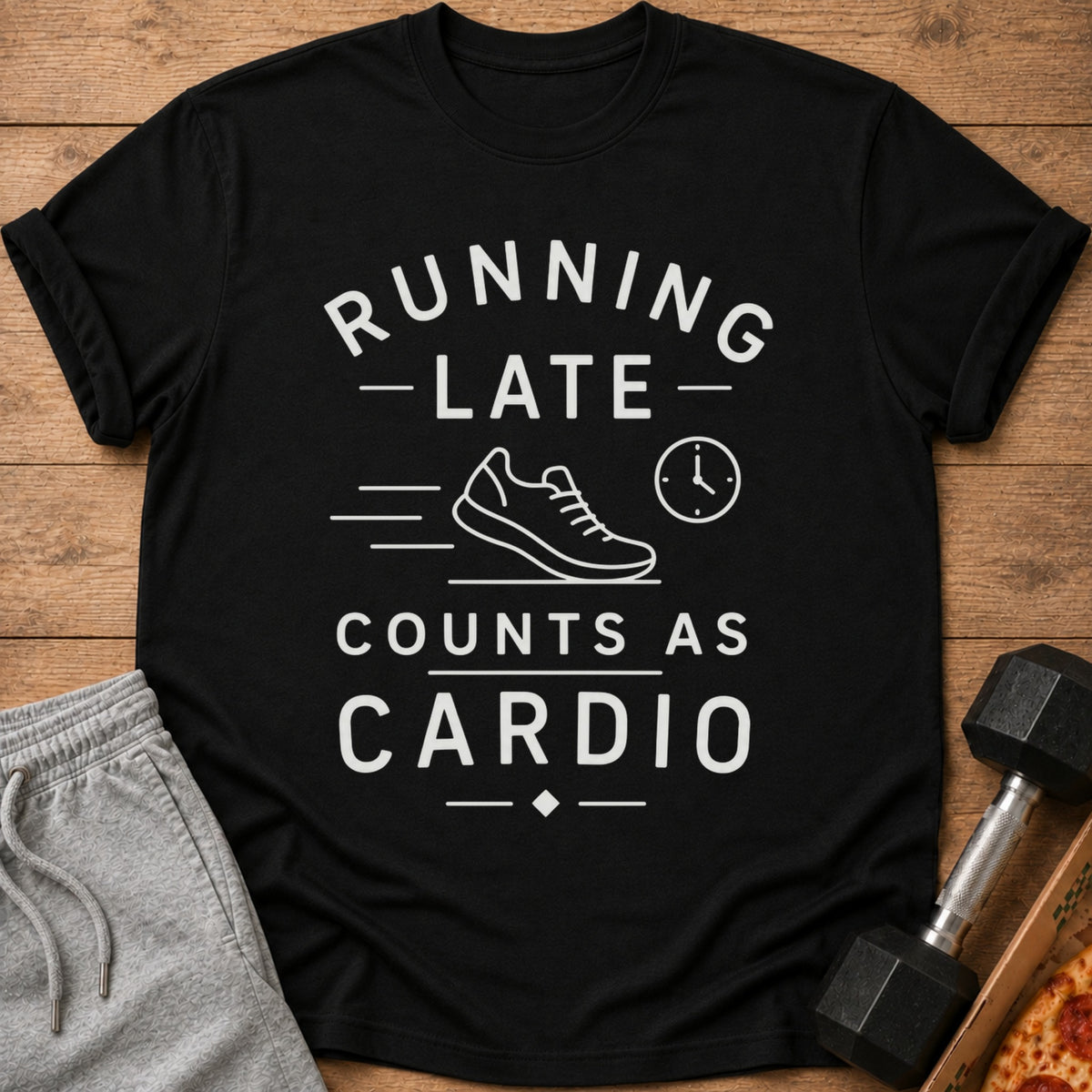 Black t-shirt with white text: "Running late counts as cardio" and shoe graphic.
