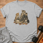Three kittens playing with a shoelace inside a worn sneaker on autumn leaves.