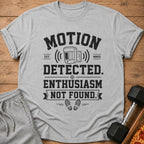 Grey t-shirt with text "MOTION DETECTED. ENTHUSIASM NOT FOUND." and a motion sensor graphic.