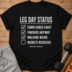 Black t-shirt with "LEG DAY STATUS" checklist: Complained, Finished, Walking Weird, Regrets Resolved.