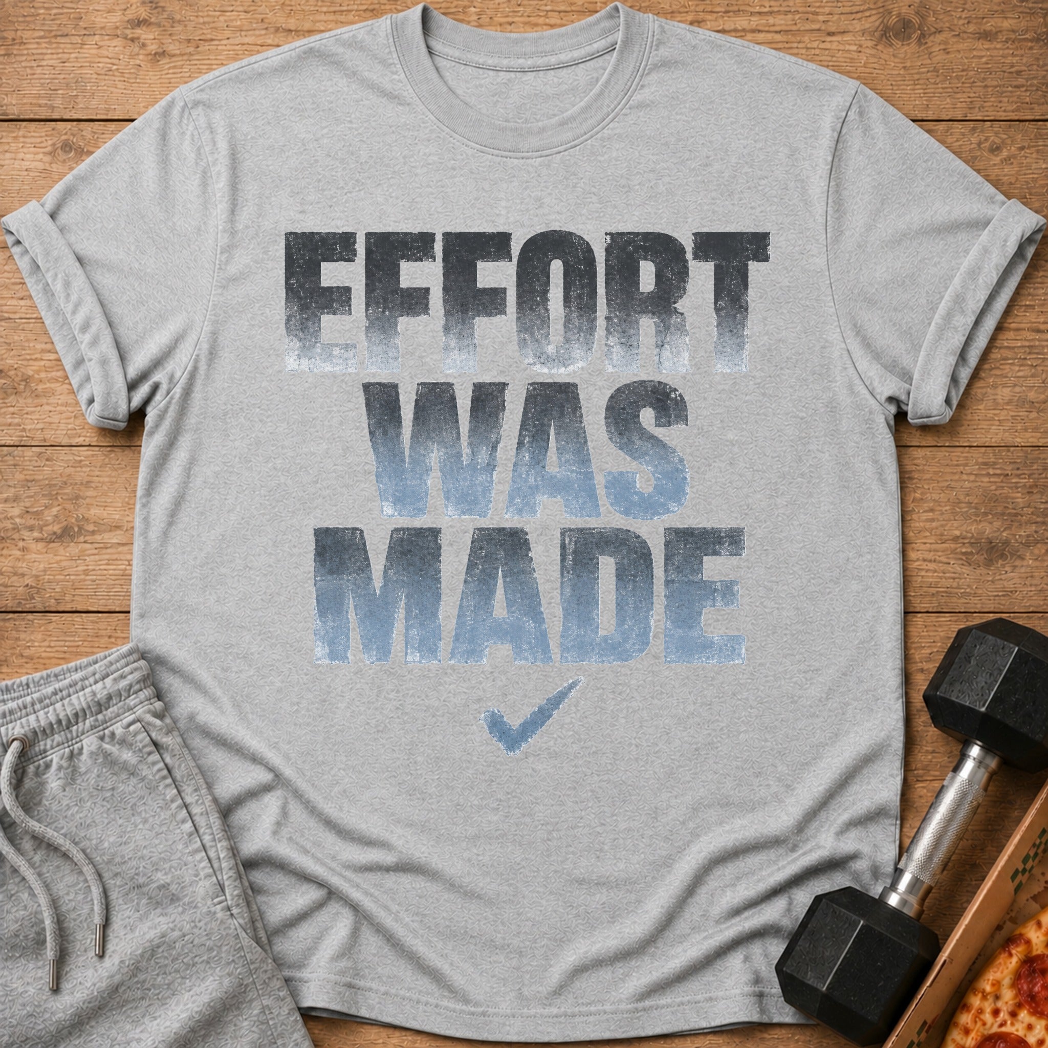 Grey t-shirt with the text "EFFORT WAS MADE" and a blue checkmark.