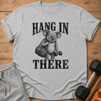 Gray t-shirt with a koala graphic and text "HANG IN THERE."