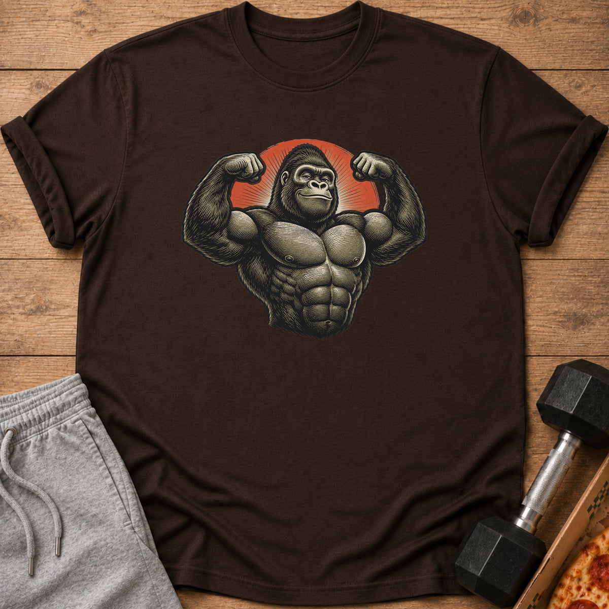 Brown t-shirt with a muscular gorilla graphic and a red sunburst background.