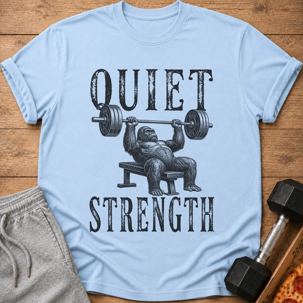 Light blue t-shirt with a gorilla bench pressing and text "QUIET STRENGTH".
