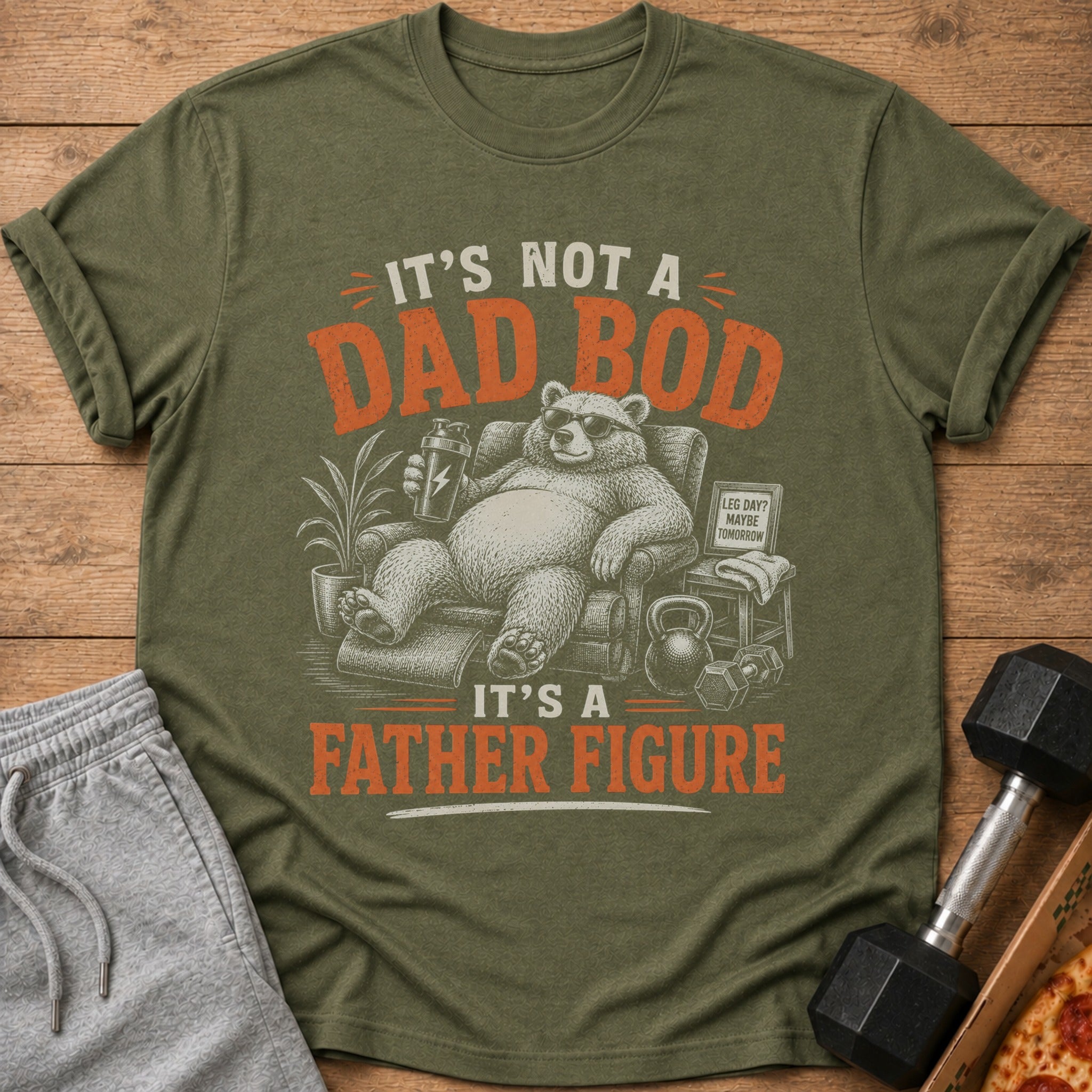 Green t-shirt with text "IT'S NOT A DAD BOD IT'S A FATHER FIGURE" and a bear graphic.