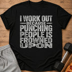 A black t-shirt printed with the white text, I WORK OUT BECAUSE PUNCHING PEOPLE IS FROWNED UPON.