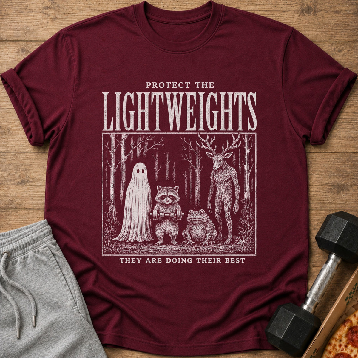 Maroon t-shirt with "Protect the Lightweights" and forest creatures lifting weights.