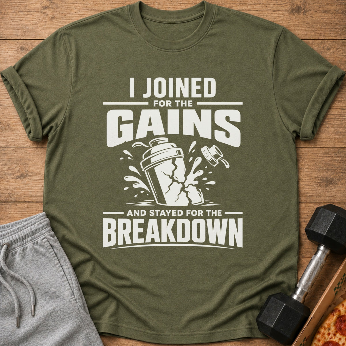 Olive green t-shirt with "I JOINED FOR THE GAINS AND STAYED FOR THE BREAKDOWN" graphic.