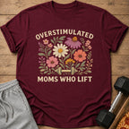Maroon t-shirt with "Overstimulated Moms Who Lift" text and floral dumbbell graphic.