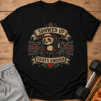 Black t-shirt with a tired panda lifting a barbell, text says "SHOWED UP THAT'S ENOUGH".